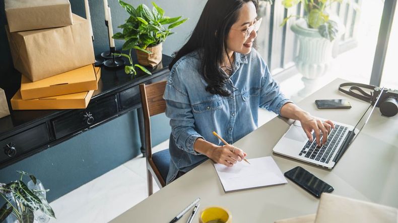 Entrepreneur researching tips to improve e-commerce sales.