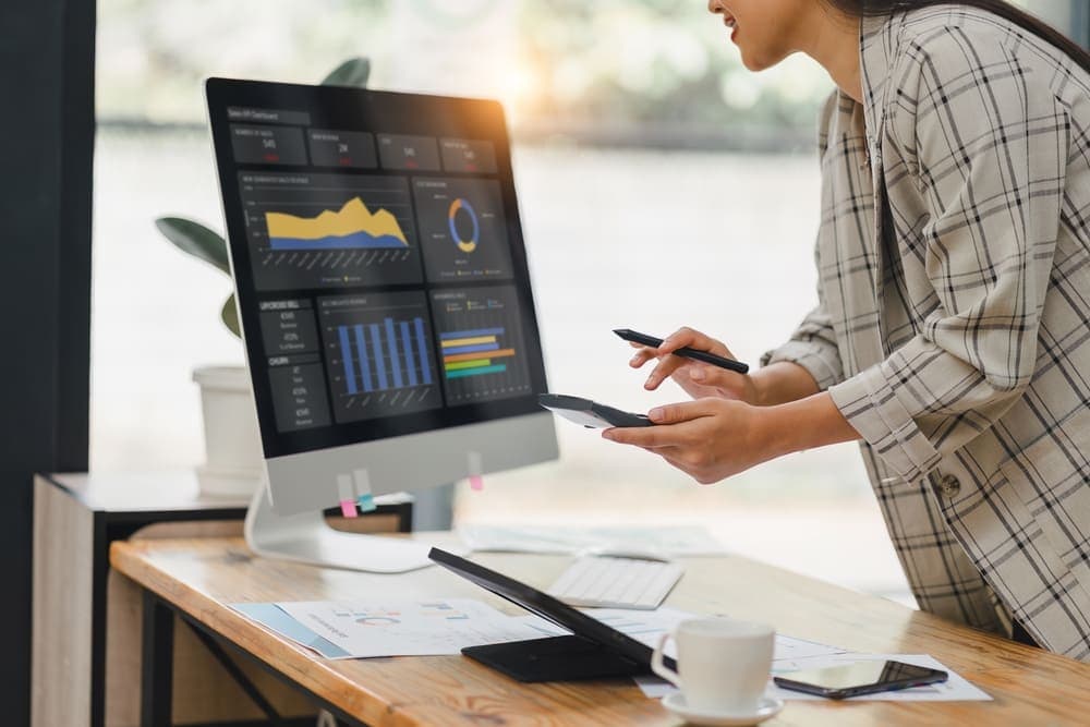 A woman analyzing a CRM system chart