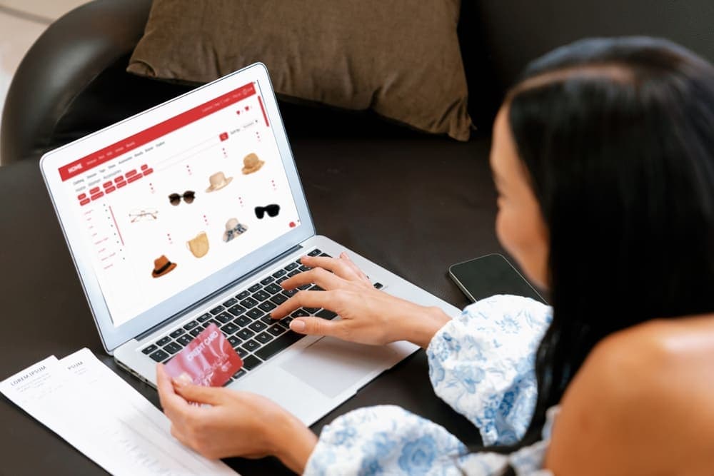 A woman using a laptop for online shopping
